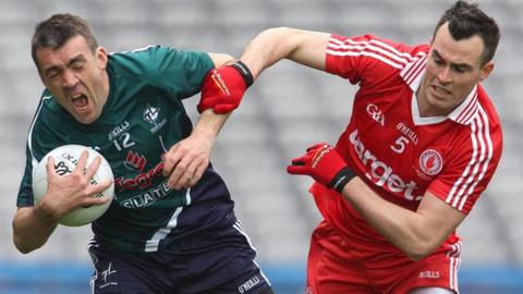 Johnny Doyle battles with Cathal McCarron at Croke Park
