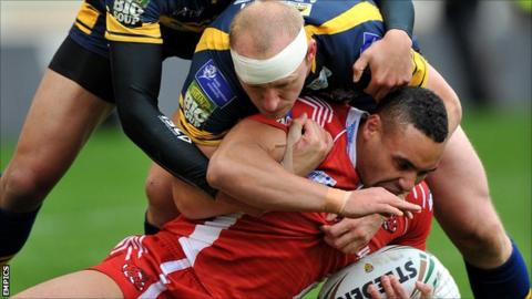 Salford and Leeds in action during their Challenge Cup fifth-round tie