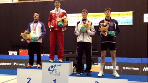 Richard Kruse (right) collects bronze