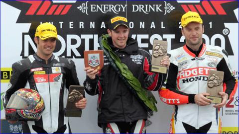 Cameron Donald and Bruce Anstey flank last year's Supersport winner Alastair Seeley