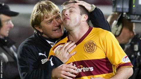 McCall congratulates midfielder Steve Jennings at Tynecastle