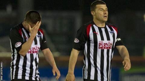 Joe Cardle and Austin McCann leave the field disappointed at the result