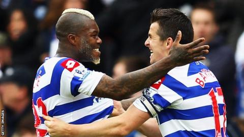QPR's Djibril Cisse and Joey Barton celebrate their side's win against Stoke