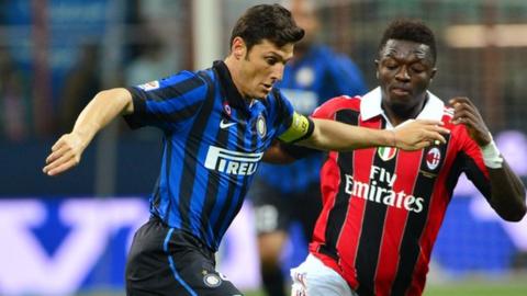 Sulley Muntari (right) was racially abused by some fans of his former club, Inter Milan