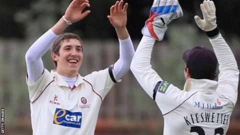 Craig Overton celebrates a wicket