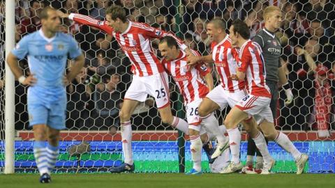 Peter Crouch celebrates his goal against Man City
