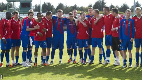 The Inverness CT squad group together to acknowledge the home support after the last game of the SPL season