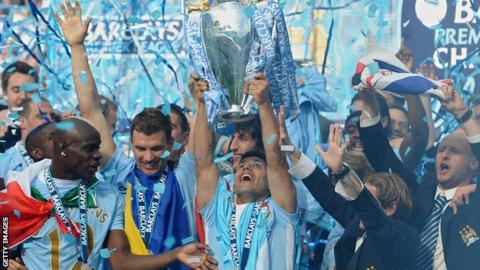 Sergio Aguero lifts the Premier League trophy