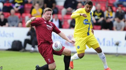 Torquay's Rene Howe (right) is certain to miss the play-off semi-final second leg because of injury