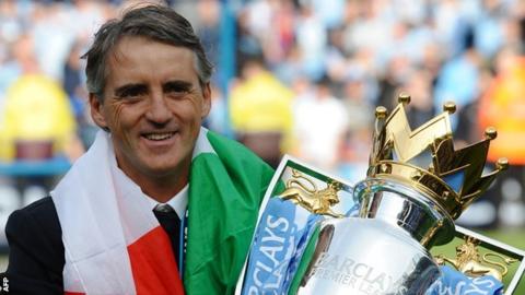 Manchester City manager Roberto Mancini with the Premier League trophy
