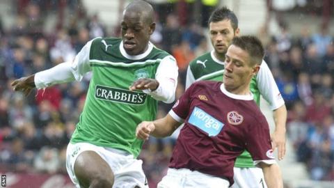 Ian Black competes for possession with Hibs' Isaiah Osbourne