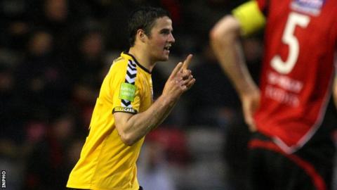 Stephen McLaughlin celebrates after heading Derry into the lead at Dalymount Park