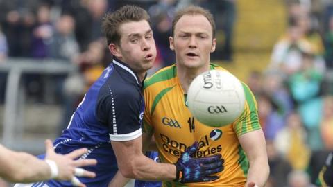 Cavan's David Givney in action against Colm McFadden of Donegal