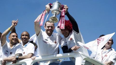 Hearts duo Craig Beattie and Rudi Skacel (right) lift the Scottish Cup trophy during the club's bus tour.