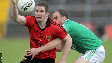 Down's Aidan Carr in possession against Brian Og Maguire of Fermanagh