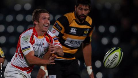 Dragons scrum-half playing against Wasps