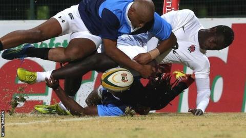 England wing Christian Wade is bundled into touch