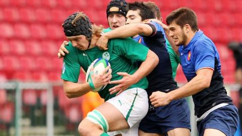 Ireland's Iain Henderson is tackled in the fifth/sixth place play-off