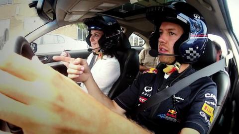 Sebastian Vettel takes Lee McKenzie for a drive