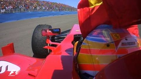 Ferrari's Fernando Alonso celebrates in front of the Spanish fans
