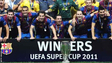 Barcelona celebrate their 2011 Super Cup win