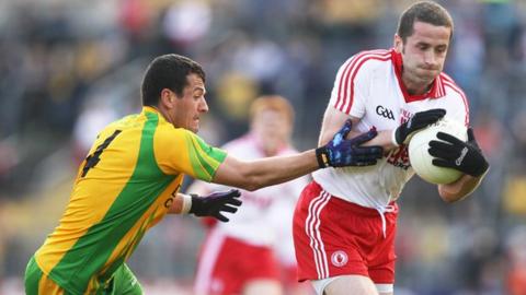 Donegal's Frank McGlynn in action against Stephen O'Neill of Tyrone