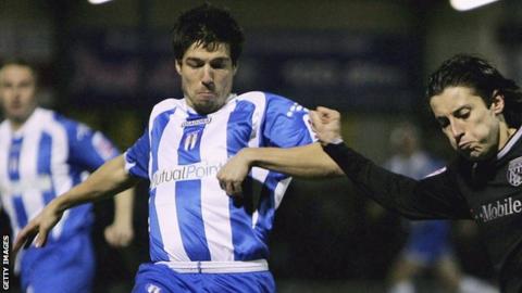 Kem Izzet (left) in action for Colchester