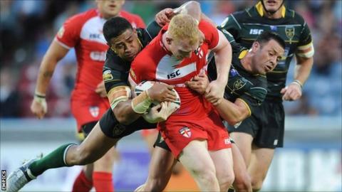 England's Liam Farrell is tackled by Exiles' Willie Manu and Lincoln Withers