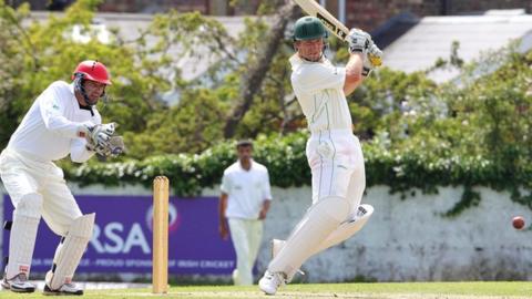 Andrew White strikes the ball away during his unbeaten 62