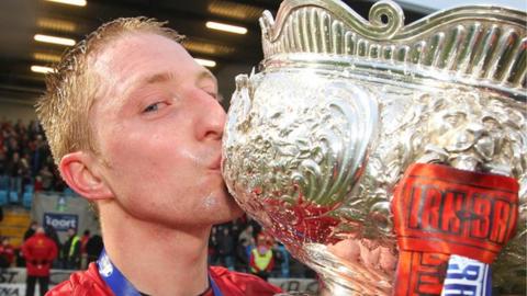 Crusaders midfielder Chris Morrow with the Irn-Bru League Cup