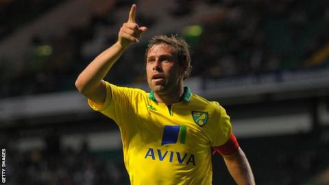 Grant Holt celebrates his winning goal at Parkhead