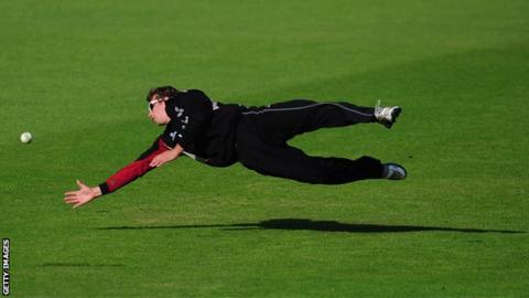Alex Barrow diving to stop the ball against Nottinghamshire