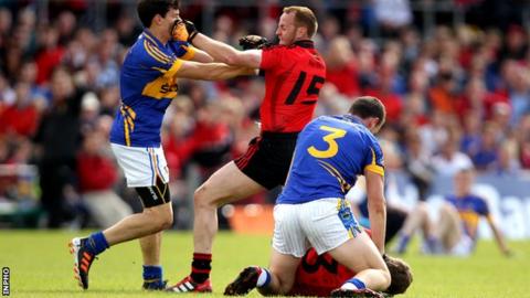 Benny Coulter clashes with Ciaran McDonald as Paddy Codd tangles with Eoin McCartan at Mullingar