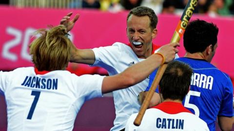 GB men's hockey team celebrate their win over Argentina
