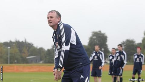 NI manager Michael O'Neill puts the assembled journalists through their paces