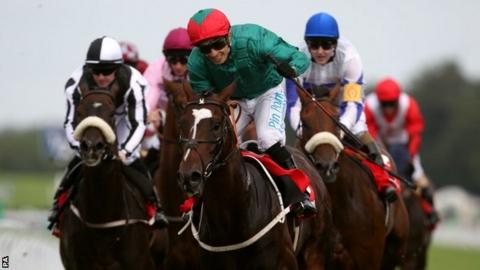 Fulbright and jockey Silvestre de Sousa (green silks with green and red hat)