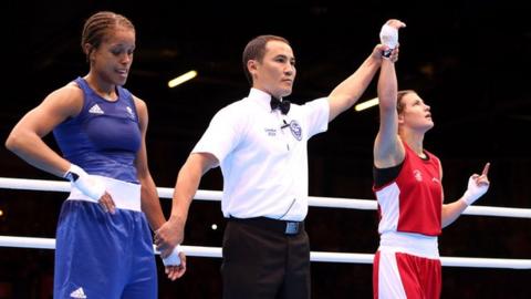 Katie Taylor celebrates defeating Natasha Jonas