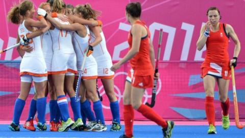 Dutch players celebrate scoring against Great Britain