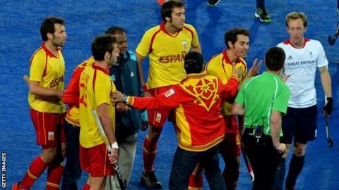 Spain's players argue with the umpire
