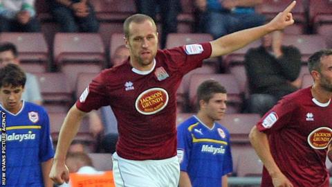 David Artell celebrates after scoring Northampton's equaliser