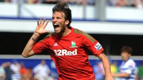 Michu celebrates after putting Swansea ahead