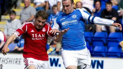 Fraser is challenged by St Johnstone defender Dave Mackay during the Dons' 2-1 win