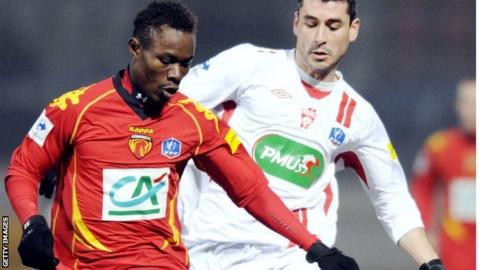 Le Mans and Benin's Khaled Adenon (left)
