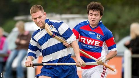 Newtonmore's Norman Campbell and Ryan Borthwick of Kingussie compete in their Orion Premiership match