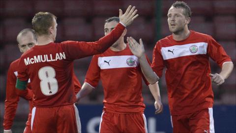George McMullan congratulates Cliftonvilel goalscorer Marc Smyth