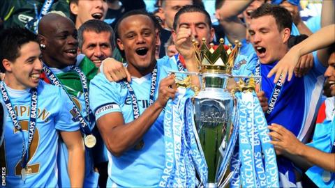 Manchester City captain Vincent Kompany lifts the Premier League trophy in May
