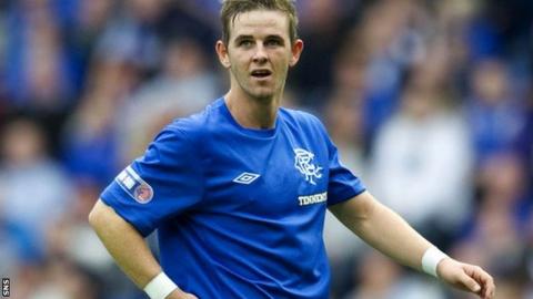 David Templeton dons a Rangers strip after his transfer from Hearts