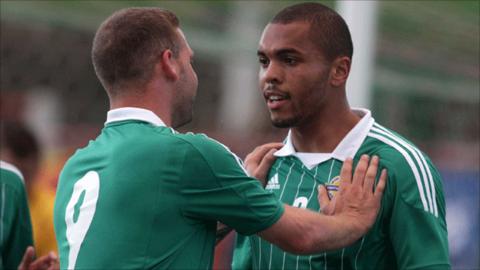 Billy Kee congratulates NI U21 goalscorer Josh Magennis