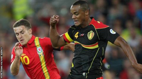 Wales captain Aaron Ramsey challenges Belgium captain Vincent Kompany