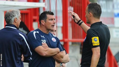 Crawley manager Richie Barker speaks to referee Darren Deadman